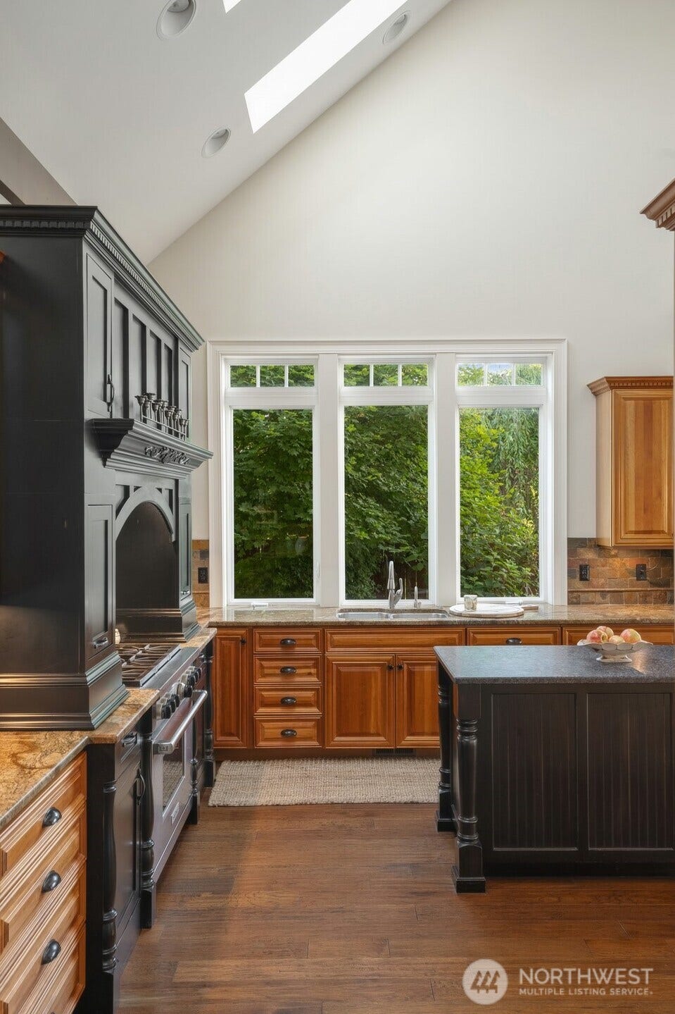 1047 SE Crestlane Drive, College Place, WA 99324 Kitchen with vaulted ceiling, skylights & view of the Blues