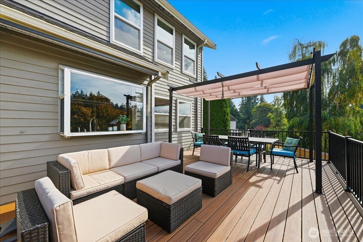13408 SE 85th Street, Newcastle, WA 98059 Off the kitchen is this large entertainment sized deck. Great for dining al fresco or just hanging out.