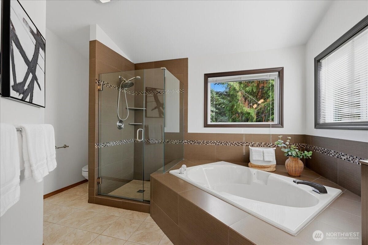 13408 SE 85th Street, Newcastle, WA 98059 Primary soaking tub and shower with frameless door.
