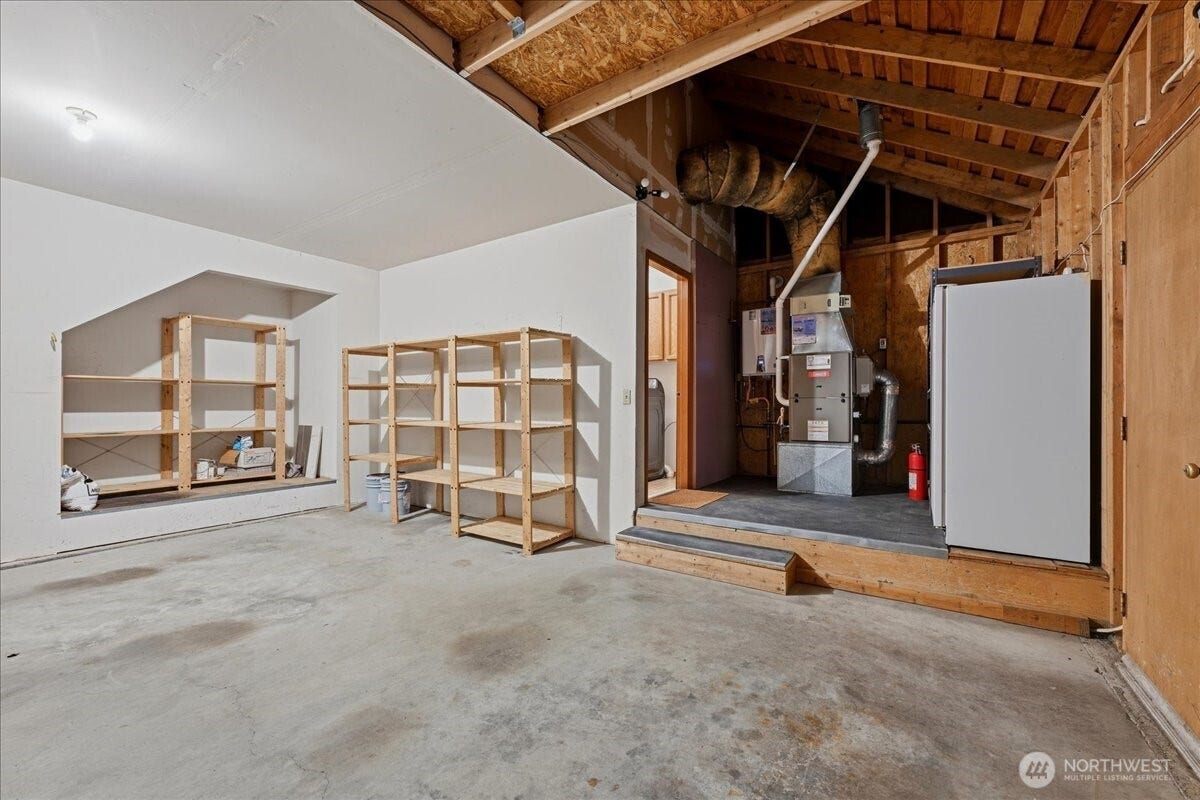 13408 SE 85th Street, Newcastle, WA 98059 Off the laundry room/mud room is this large two car garage with tons of storage space and an electric car charger included!