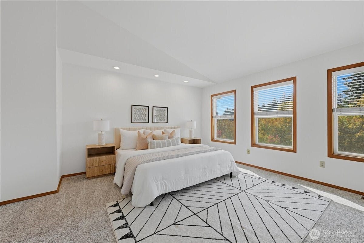 13408 SE 85th Street, Newcastle, WA 98059 Upstairs you will find all four bedrooms. This is the primary bedroom with vaulted ceilings, walk-in closet and En-suite bath.