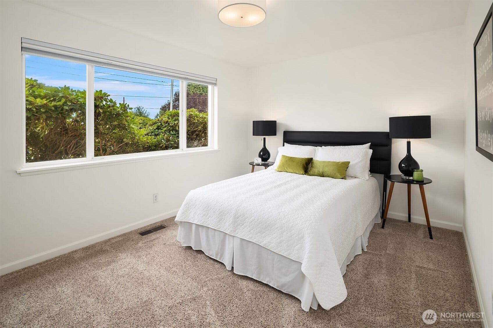 Primary bedroom can accommodate king bed and dresser.