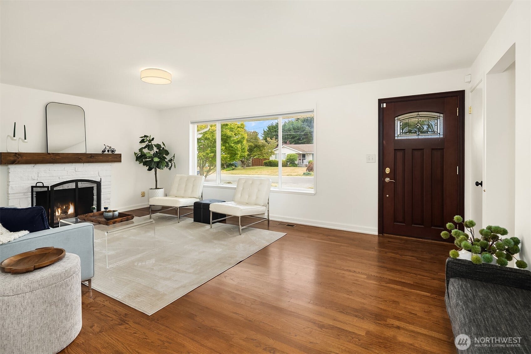 Picture windows bathe the living room in western light.