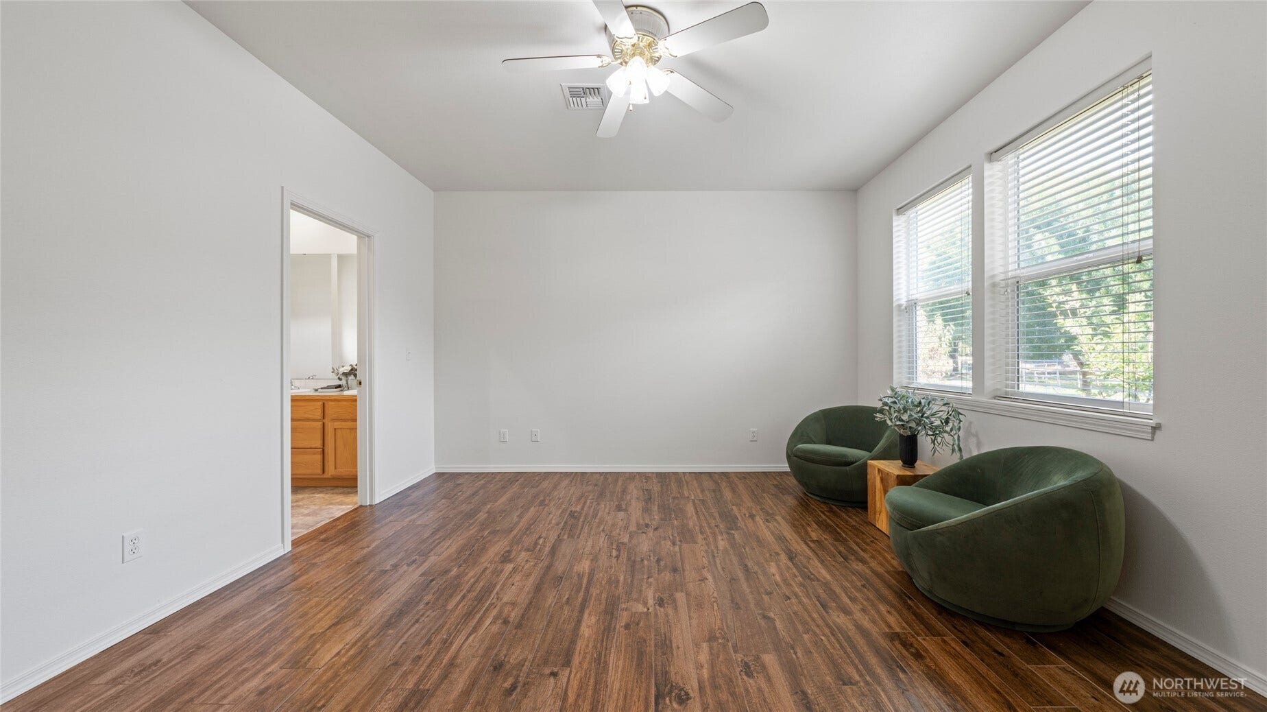 Primary bedroom with view of backyard