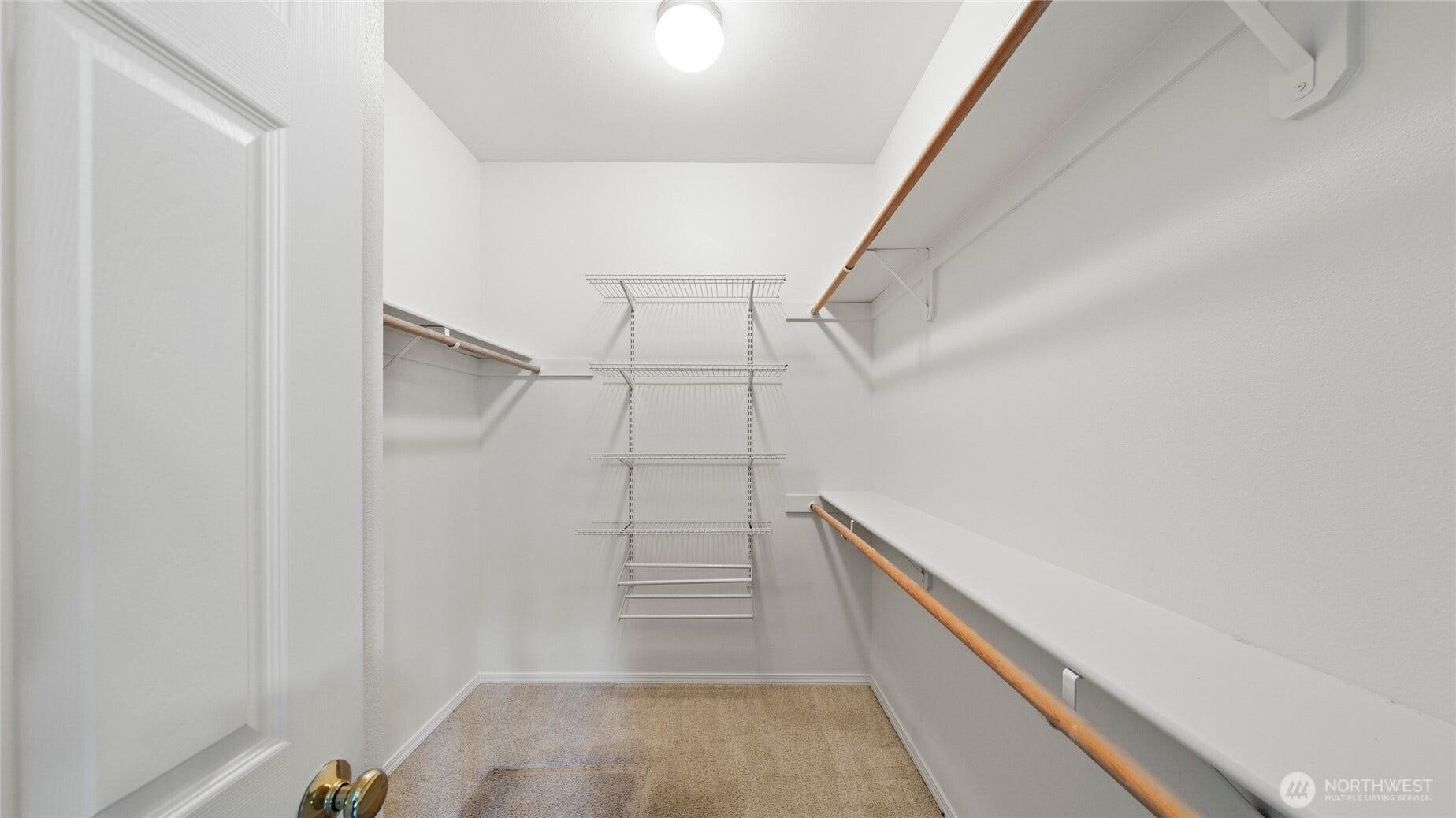 Primary bedroom walk-in closet