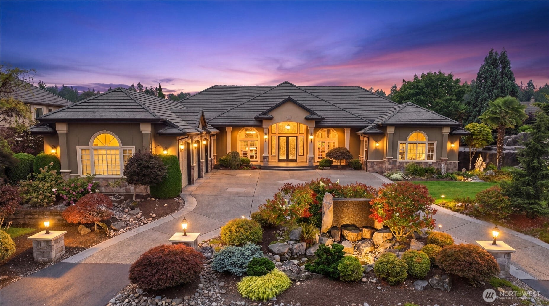 Experience resort-style living in this extraordinary Washington National Golf Course estate. This 4,740 sq ft luxury home sits on a rare 24,778 sq ft lakefront lot, offering unmatched privacy, views, and year-round recreation. Designed for single-level living, the home features a grand chefs kitchen, soaring ceilings, an elegant entertainers dining room, and an incredible primary suite with a serene sitting area. The backyard is a true destinationyour own private resortwith a dream pool, hot tub, slide, waterfall, grotto, heated swim-up bar, outdoor kitchen, TV, and fire pit. Enjoy an expansive covered outdoor living room with fireplace overlooking the lake. Inside, the Seahawk-themed theater room delivers the ultimate game-day experience. With 4 bedrooms, 4.25 baths, and seamless indoor-outdoor flow, this home offers luxury, comfort, and entertainment at every turn. Live steps from the community golf course and embrace a lifestyle where every day feels like vacation.