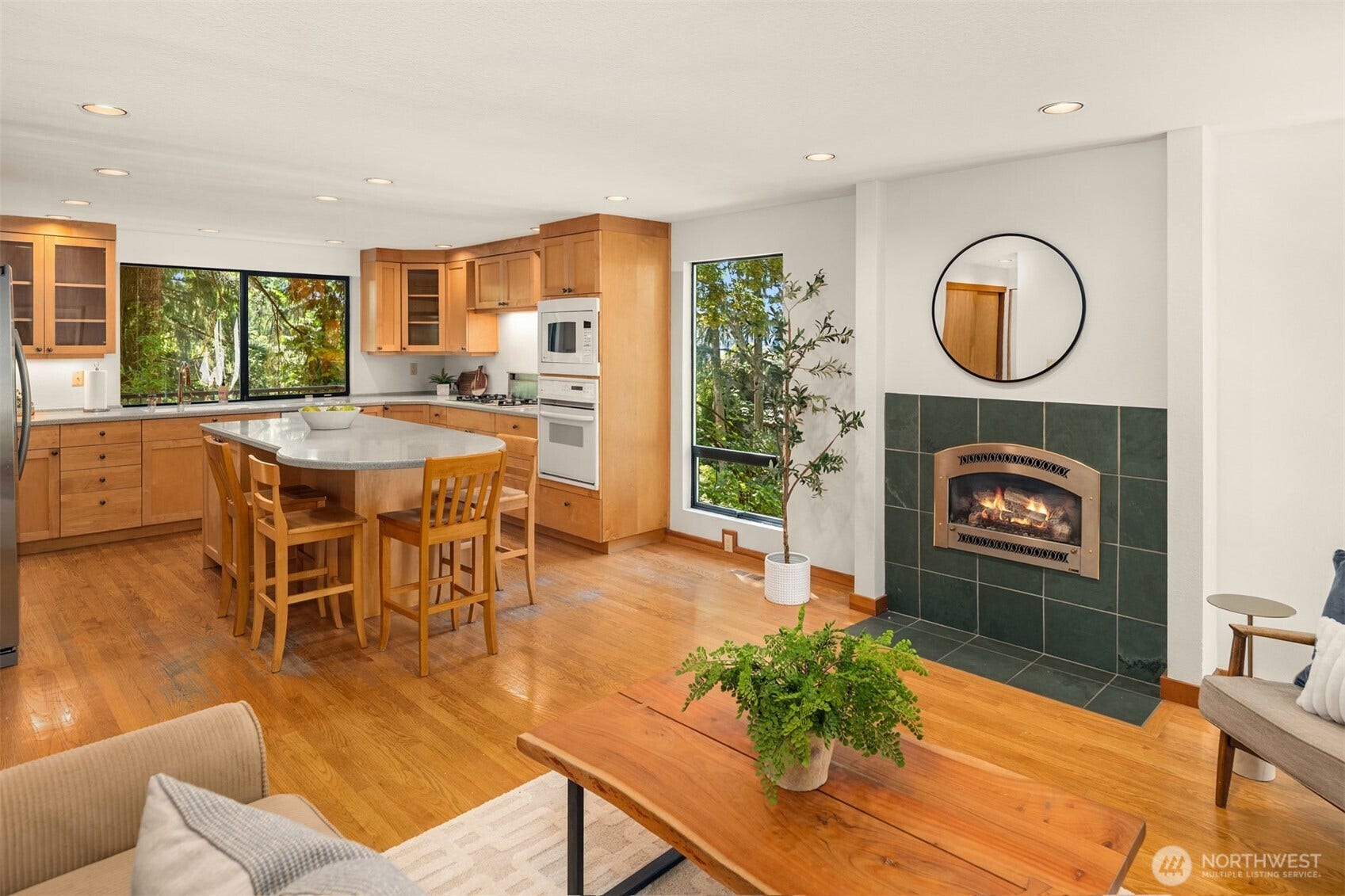 4336 E Mercer Way, Mercer Island, WA 98040 The kitchen opens to a comfy, fireside family room.