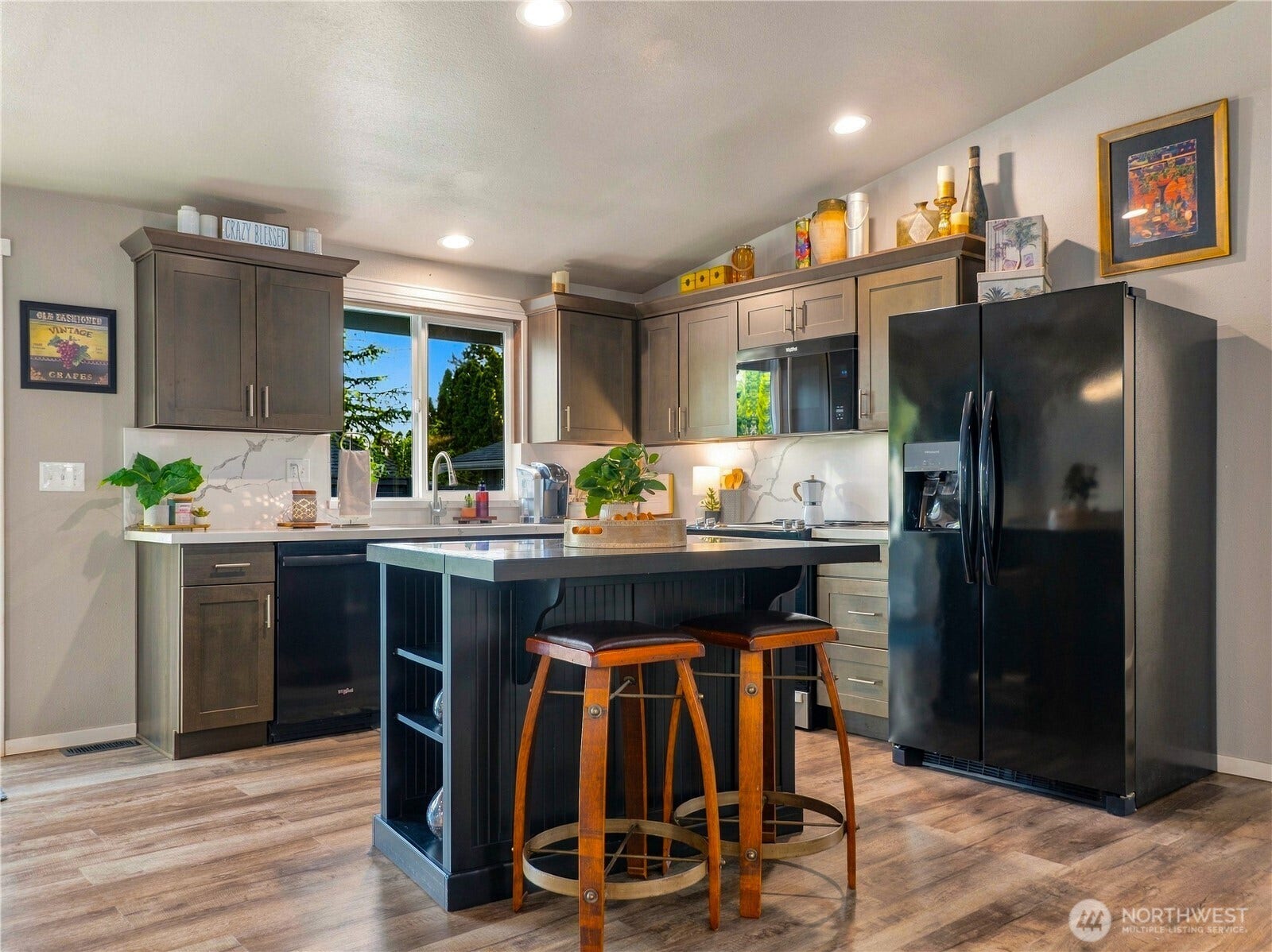 1409 1st Street, Port Townsend, WA 98368 Recently remodeled kitchen featuring quartz countertops and backsplash, new dovetail soft-close cabinetry, and updated hardware.