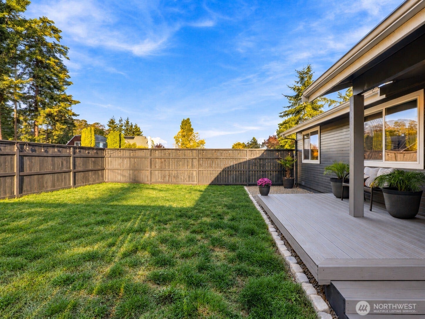 1409 1st Street, Port Townsend, WA 98368 Fully fenced front yard with new fencing and a freshly painted exterior.