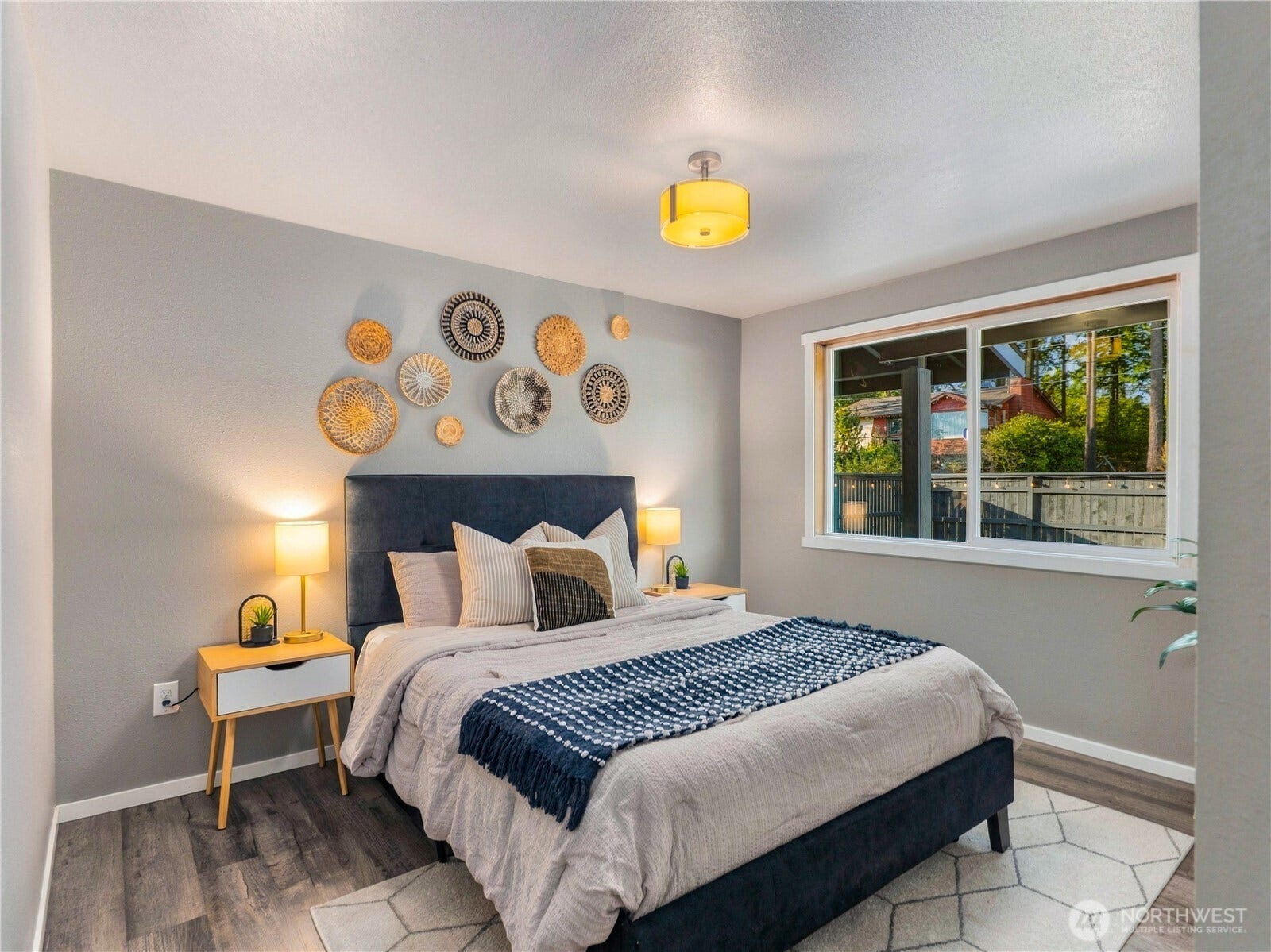 1409 1st Street, Port Townsend, WA 98368 Spacious guest bedroom featuring new blinds, updated flooring, new doors, fresh paint, and updated fixtures.