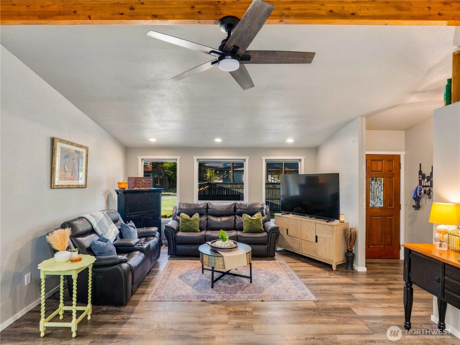 1409 1st Street, Port Townsend, WA 98368 Open-concept living with vaulted ceilings and an exposed beam - perfect for entertaining with a seamless flow from the kitchen to the deck and fully fenced backyard.