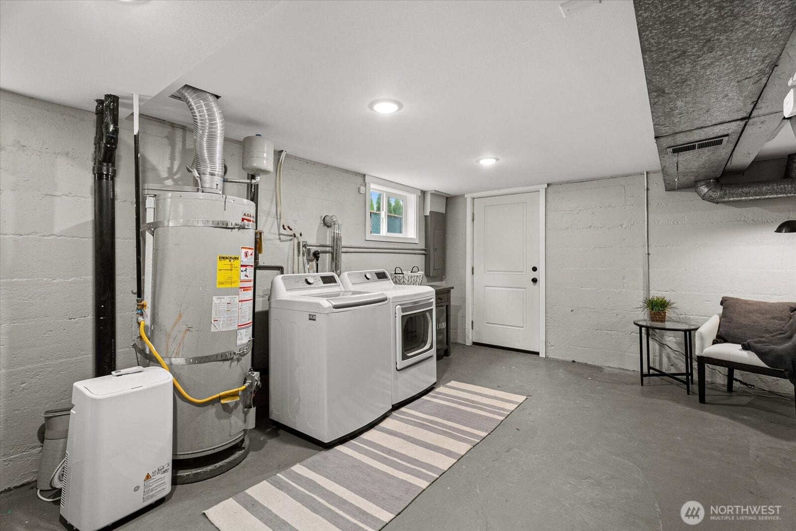 1020 S 43rd Street, Tacoma, WA 98418 Lower level also has its own exterior entrance. Laundry area with Natural Light creates a pleasant space to do laundry or utilize the clean ample space for your needs.