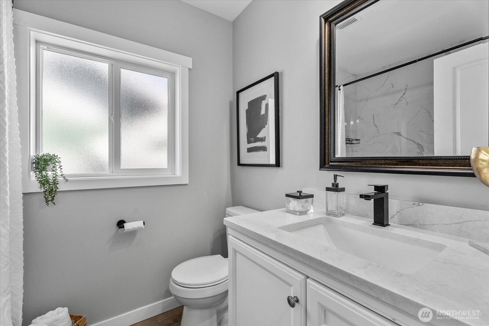 1020 S 43rd Street, Tacoma, WA 98418 An Updated Bath includes Tiled Bath and Shower surround, Stylish Matte Black fixtures and Quartz Counters on 3 year new cabinetry.