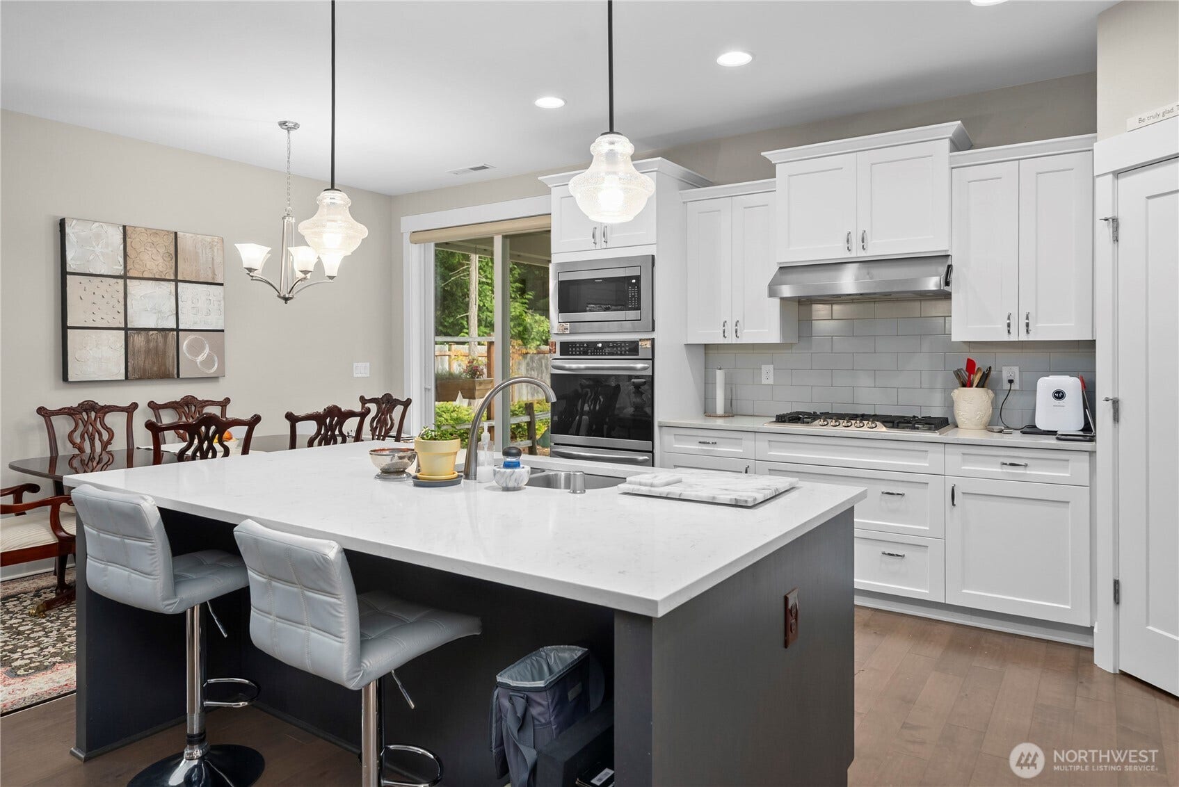 3413 Fox Court, Gig Harbor, WA 98335 Sliding door to the covered patio conveniently located off the kitchen and dining - ready for BBQing!