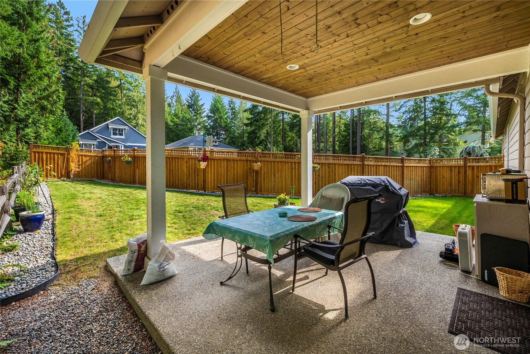 3413 Fox Court, Gig Harbor, WA 98335 Covered patio extends your living area. Fenced on the street side and backing to a greenbelt, you'll be able to enjoy your privacy at all times of the day and night.