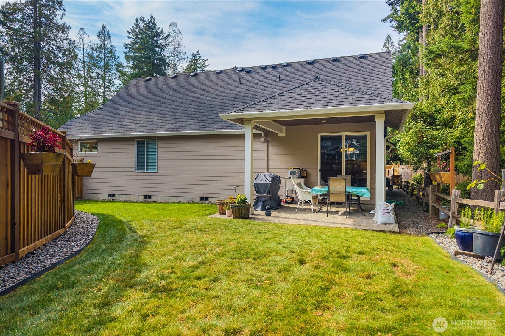 3413 Fox Court, Gig Harbor, WA 98335 Backyard is mostly fenced and has a covered patio - perfect for entertaining.