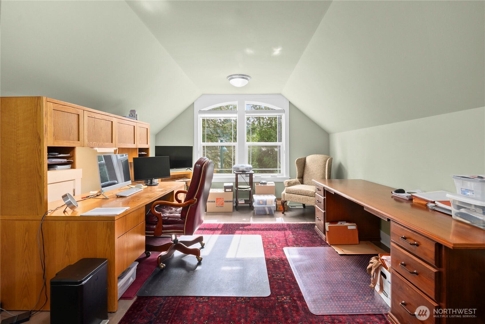 3413 Fox Court, Gig Harbor, WA 98335 Office space is kept bright with natural light thru large windows. This space would also work well as a play room or hobby room, since the main level has an office.