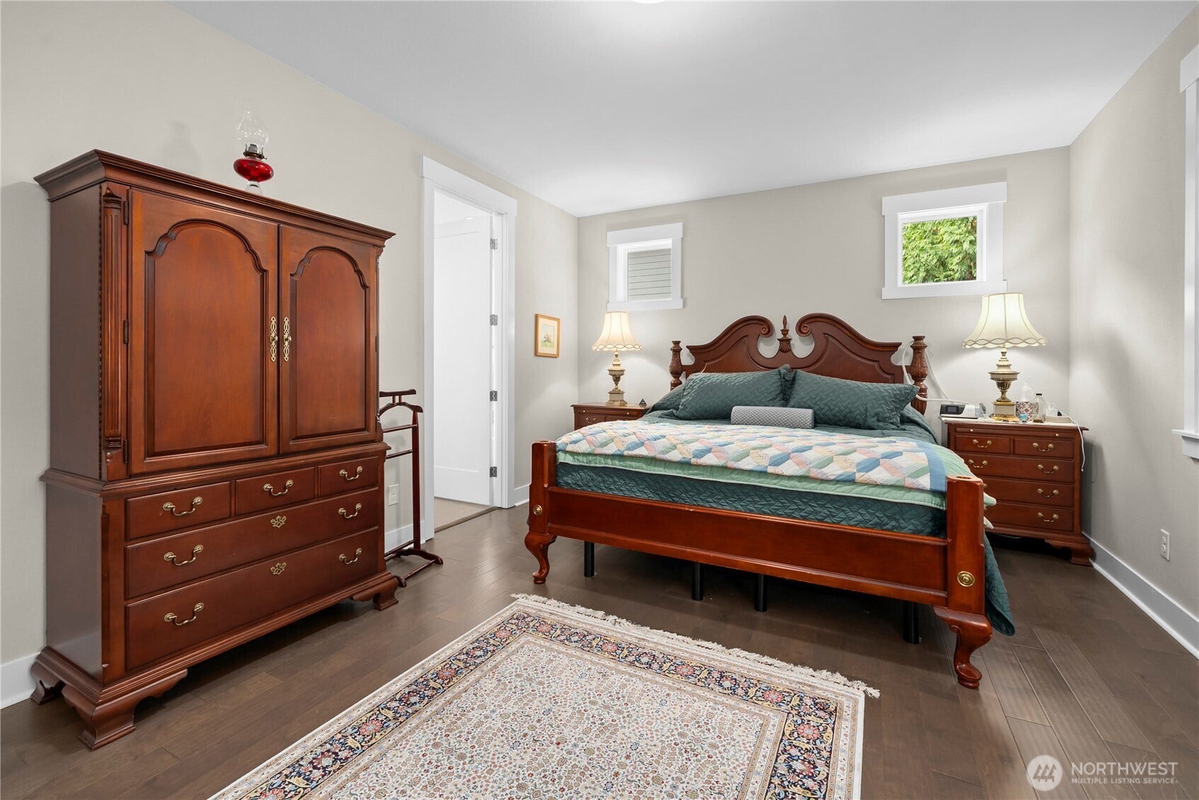 3413 Fox Court, Gig Harbor, WA 98335 Primary suite is located on the main floor and has plenty of space. Custom blinds are controlled by a remote.