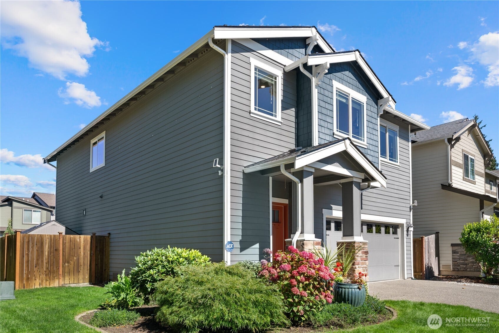 10419 11th Street Ct E, Edgewood, WA 98372 A Striking former Model home has smart home capabilities..