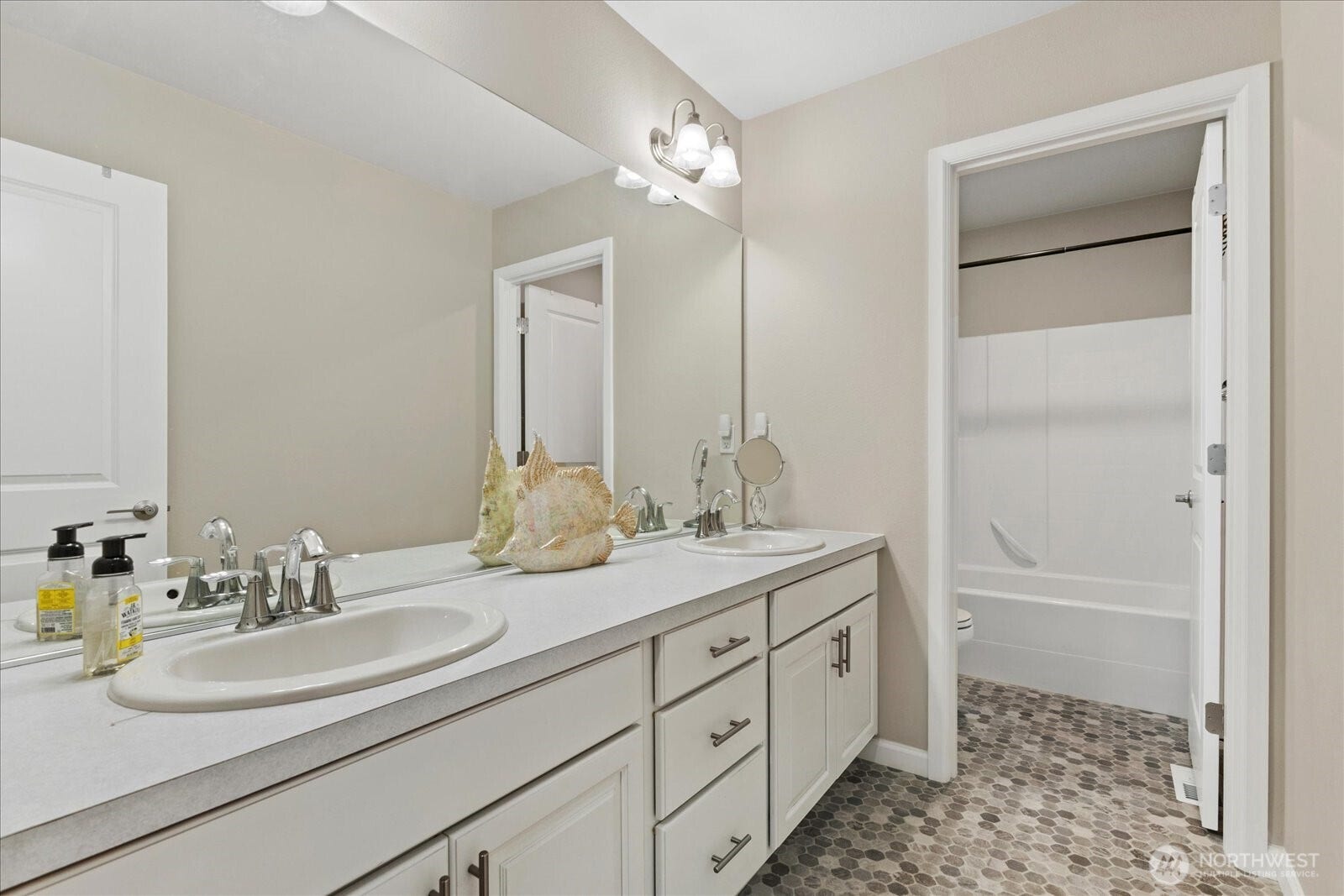 10419 11th Street Ct E, Edgewood, WA 98372 The Main bath features a long double vanity.