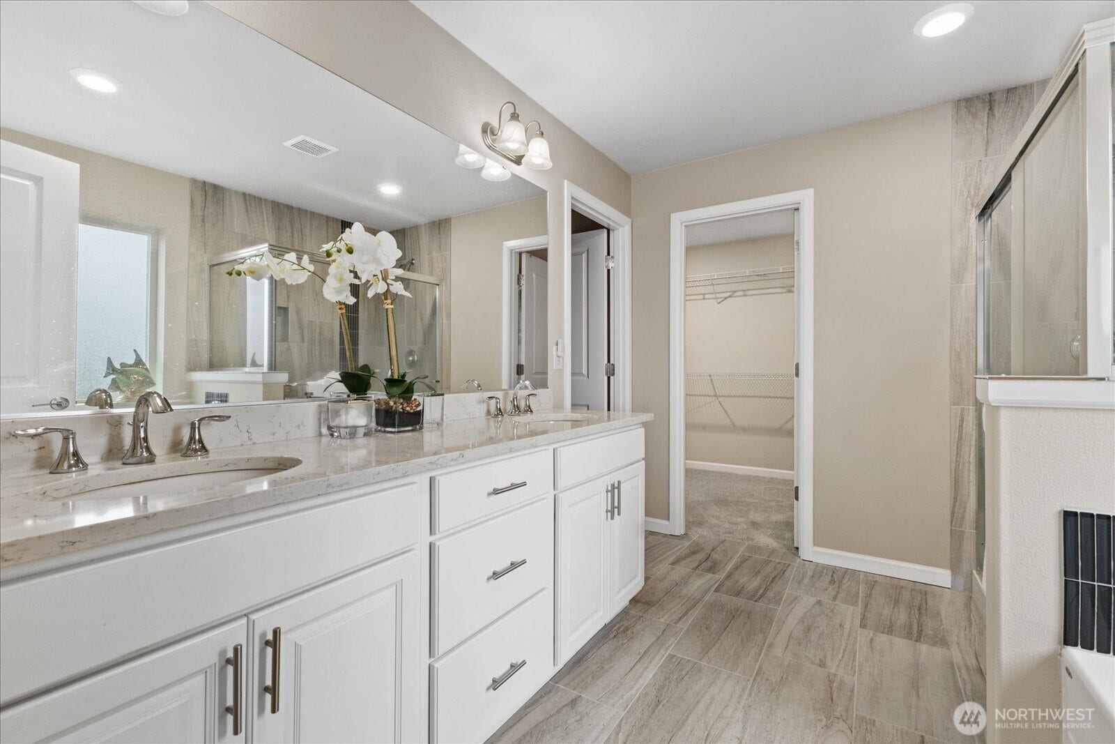 10419 11th Street Ct E, Edgewood, WA 98372 A Long Quartz Vanity in the Primary Bath completes this spa like Bath.