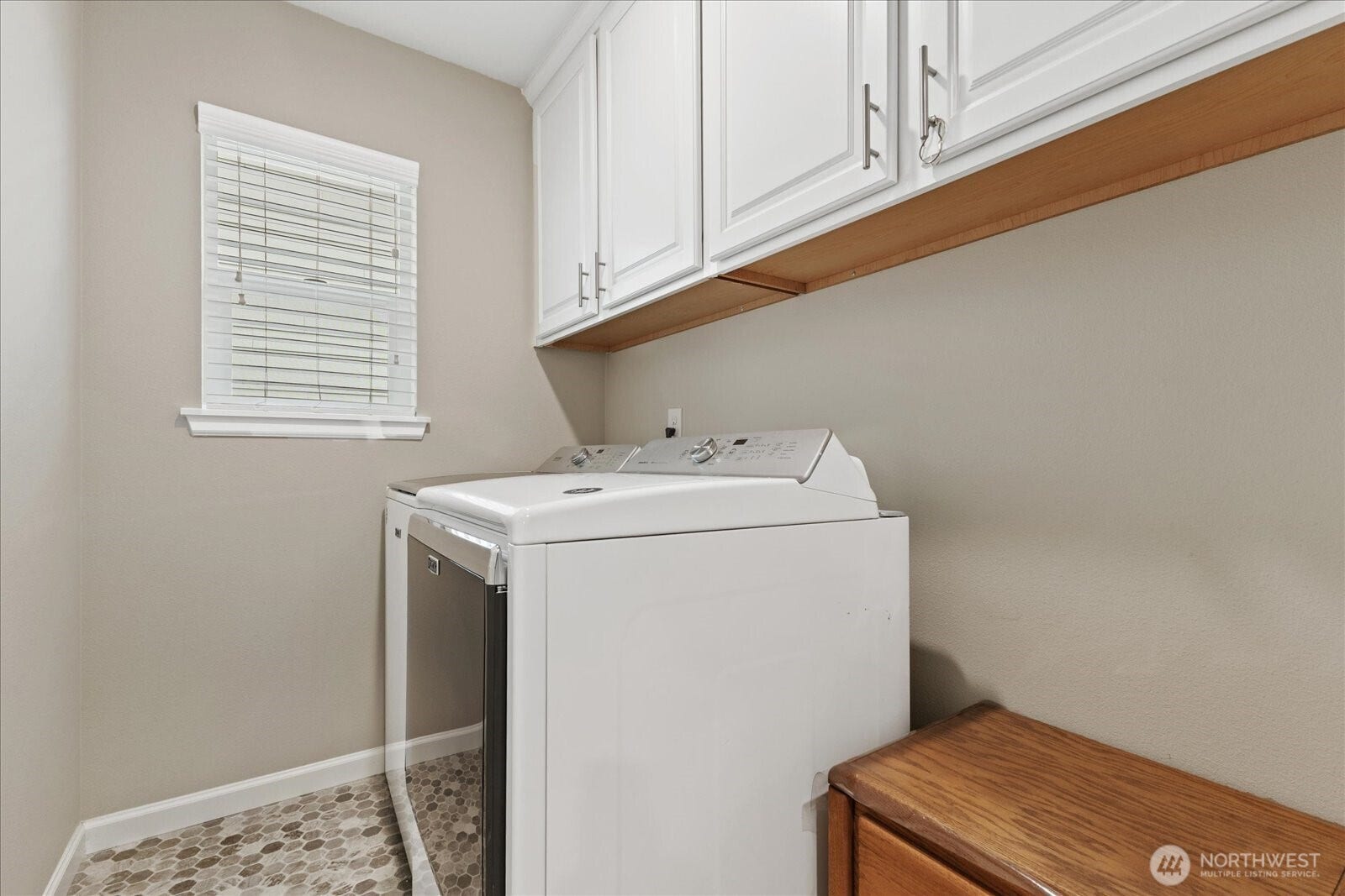 10419 11th Street Ct E, Edgewood, WA 98372 The Laundry room is complete with Cabinetry to keep it neat and tidy.