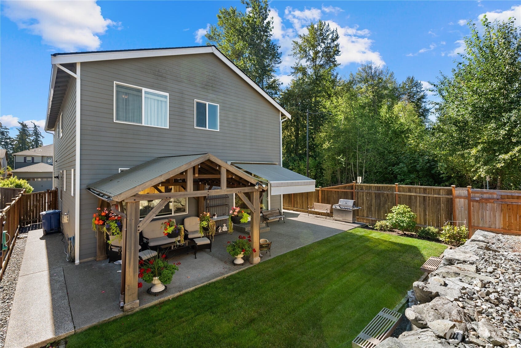 10419 11th Street Ct E, Edgewood, WA 98372 Another view of all of the concrete work that was added to this home by the sellers to make it easy to maintain a manicured look.