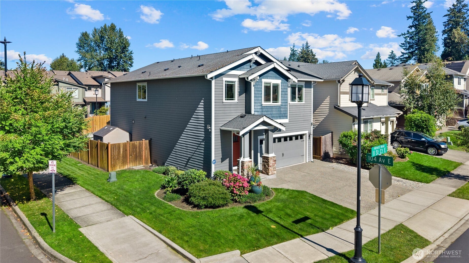 10419 11th Street Ct E, Edgewood, WA 98372 Lush manicured landscaping completes this home with cement garden curbs and concrete sidewalks on both the garage side yard and the shed side yard. Seller added these Landscaping upgrades.