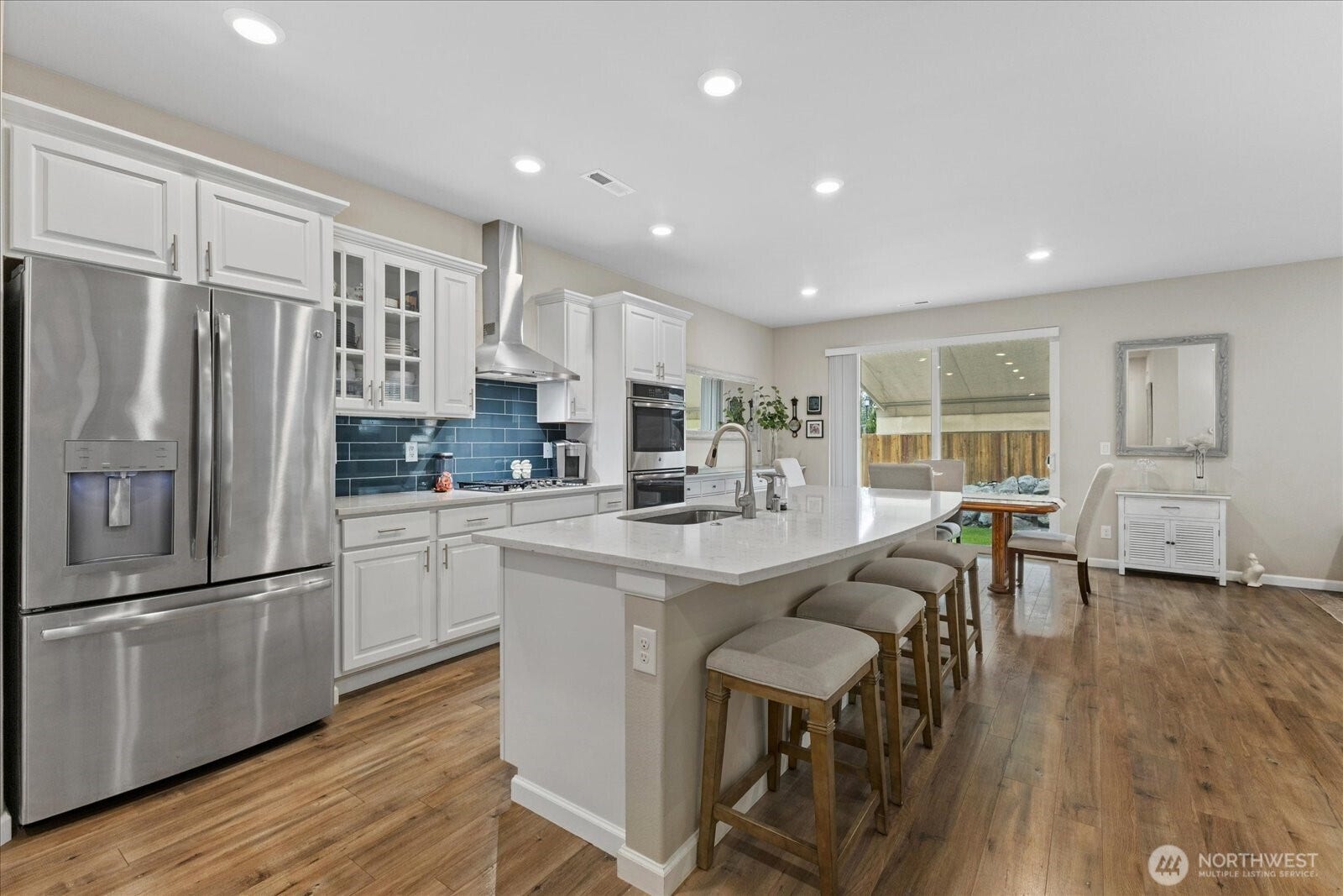 10419 11th Street Ct E, Edgewood, WA 98372 This Kitchen is well appointed with Quartz Counters and 9.4FT Long Kitchen Island plus an updated Double Drawer Stainless Luxury Dishwasher offering Small or Large washing options plus an upgraded Drawer Refridgerator!