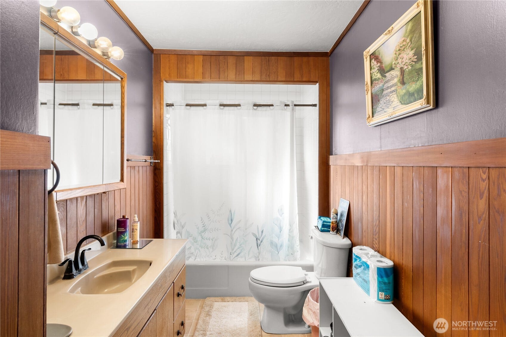 Full bath on main level with beautiful wood accent walls