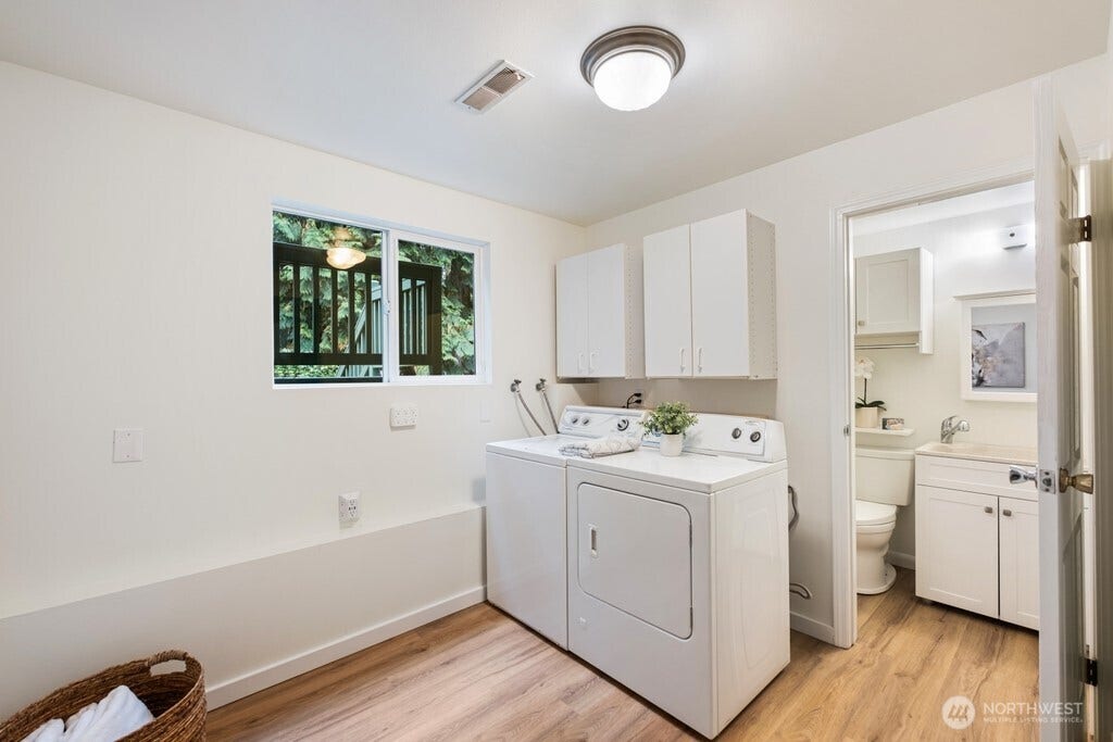 16817 NE 91st Street, Redmond, WA 98052 Extra large laundry center with tons of space and storage with convenient bathroom attached