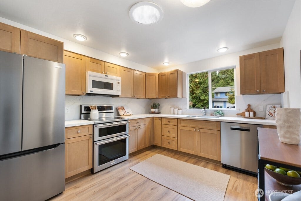 16817 NE 91st Street, Redmond, WA 98052 Remodeled kitchen with quality wood cabinetry and solar tube skylight, keeping things bright