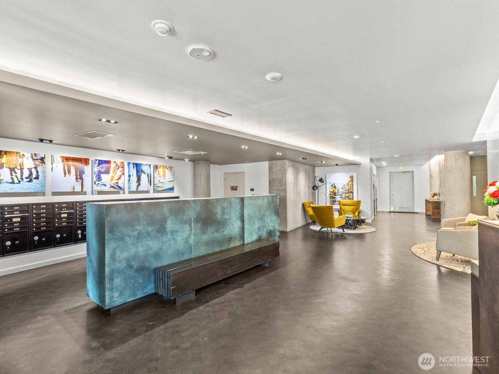 Just inside the secure entrance is the mail room and concierge desk.