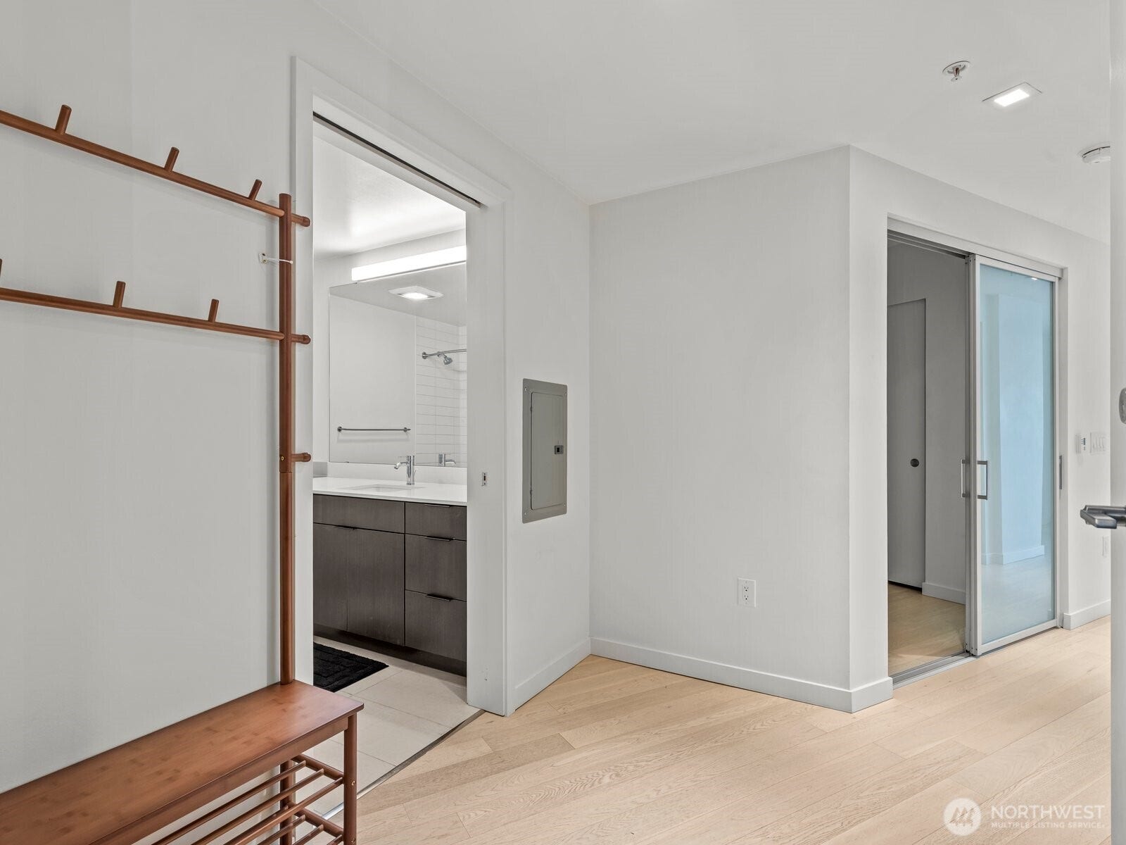 As you enter this 6th floor condo, you're warmly greeted by the beautiful floors and open entry.