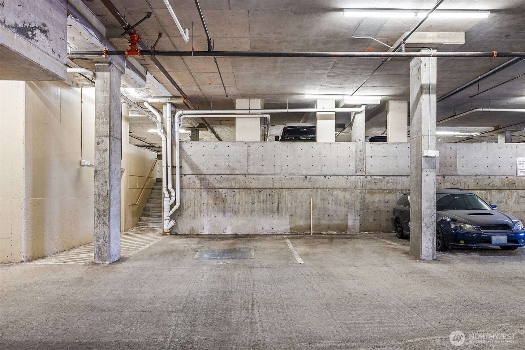 Community amenities include secure garage parking, storage, fitness center, landscaped courtyard and rooftop deck with panoramic views. Designated parking spot in parking garage #27.