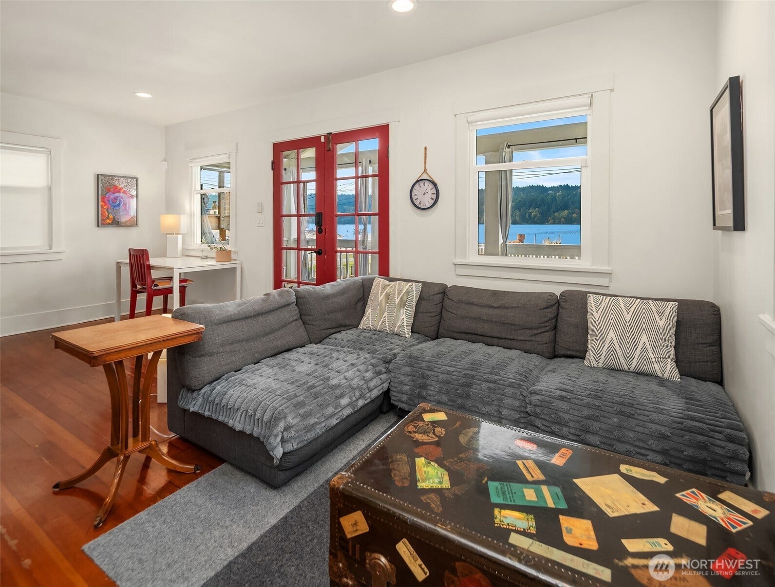 27730 Manzanita Beach Road SW, Vashon, WA 98070 Comfy and cozy living room is the perfect spot for watching wildlife and the passing storms coming across from Vashon.