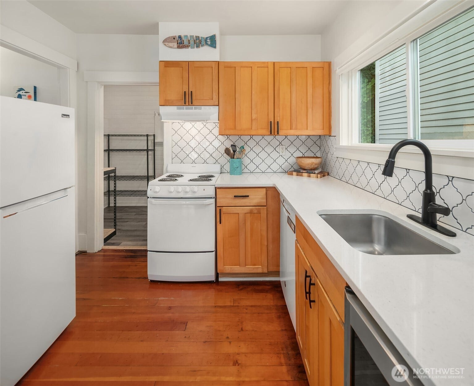 27730 Manzanita Beach Road SW, Vashon, WA 98070 Appliances were replaced in 2020, plus the tile backsplash was installed. Through the door to the left of the stove leads to your spacious utility room with an entrance to the back porch.