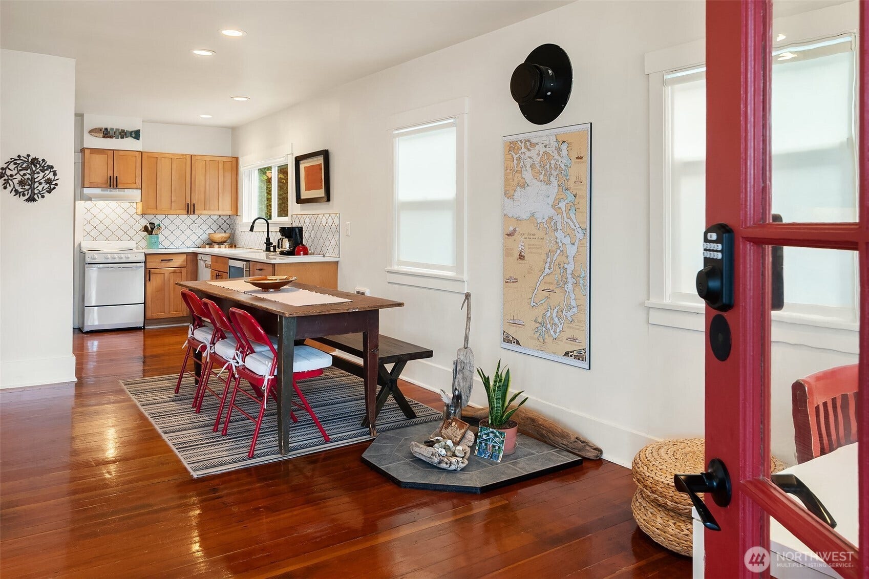27730 Manzanita Beach Road SW, Vashon, WA 98070 An open concept main level with refurbished wood floors, a thoughtfully refreshed and updated kitchen, the calmness of being at the beach - welcome you home.