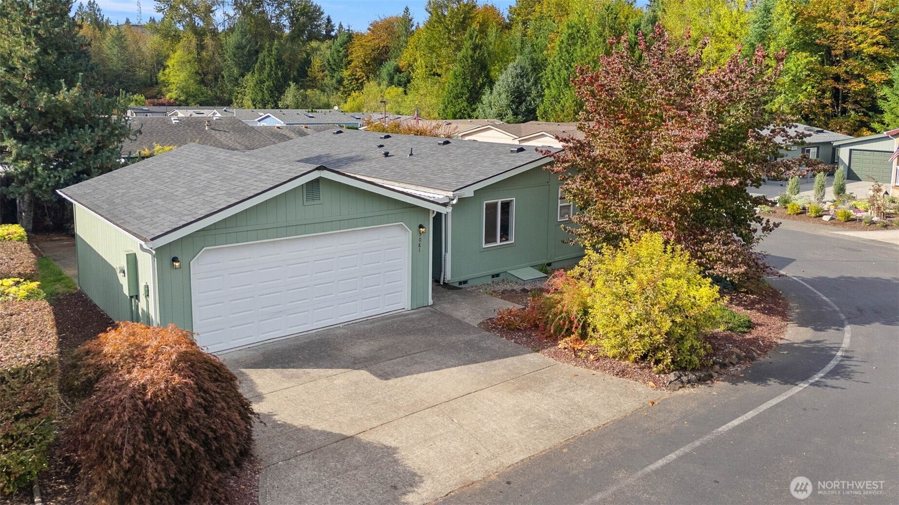 5081 E Gray Sea Eagle Lane SW, Tumwater, WA 98512 Back of home, covered walkway through garage to backdoor of home.