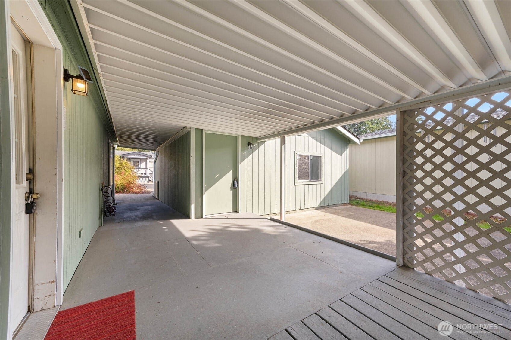 5081 E Gray Sea Eagle Lane SW, Tumwater, WA 98512 Covered walkthrough from garage to back entry of home.