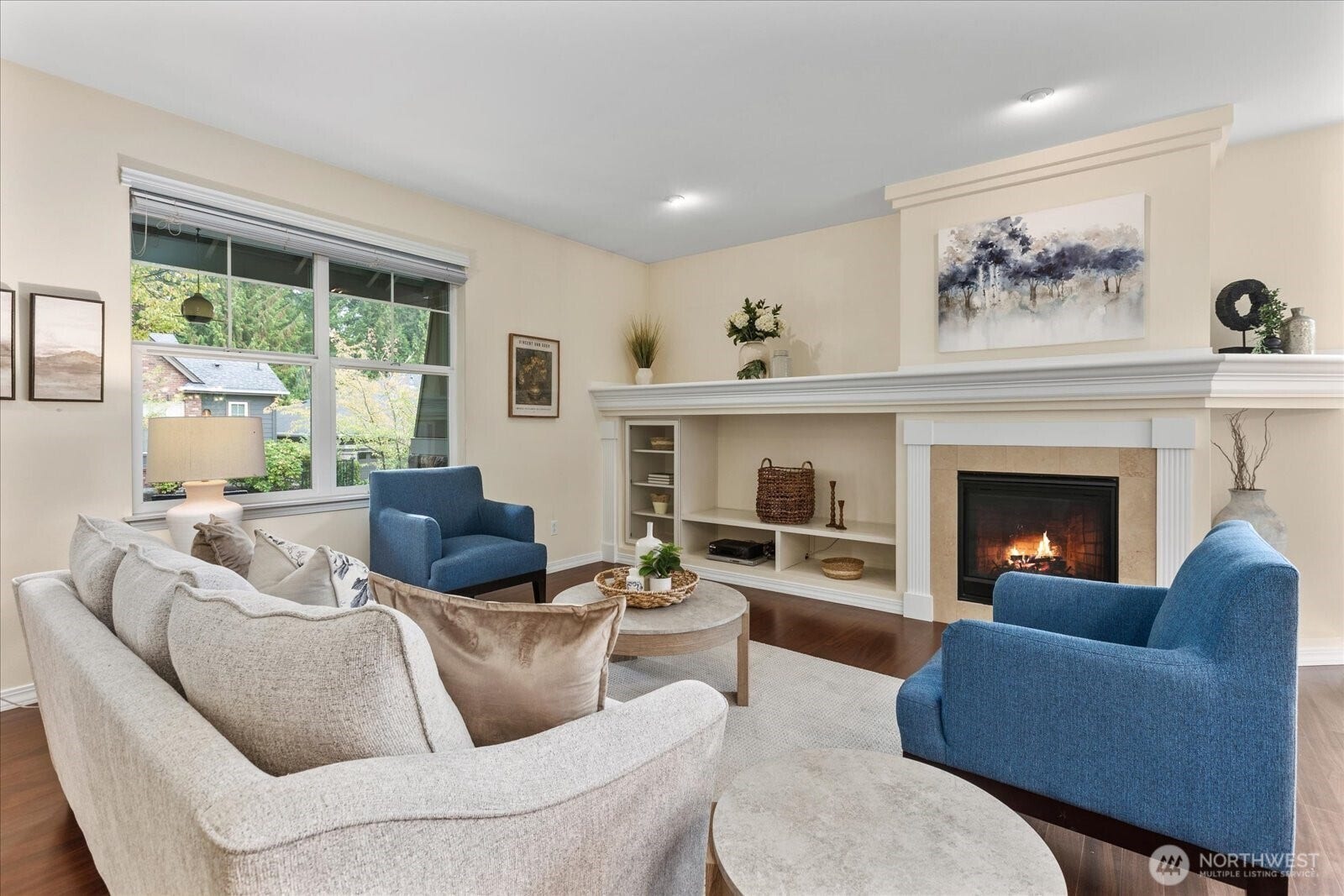 13233 239th Way NE, Redmond, WA 98053 The gas fireplace is a focal point as well as the custom mantel and built-ins by the fireplace.