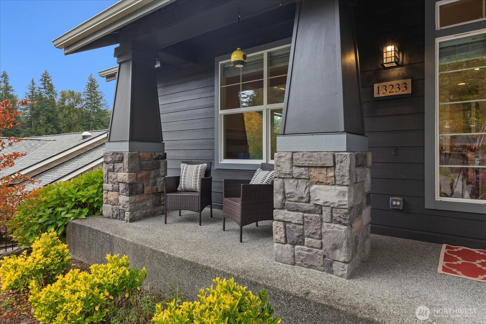 13233 239th Way NE, Redmond, WA 98053 A welcoming front porch beckons you to sit and relax and greet the neighbors walking by.