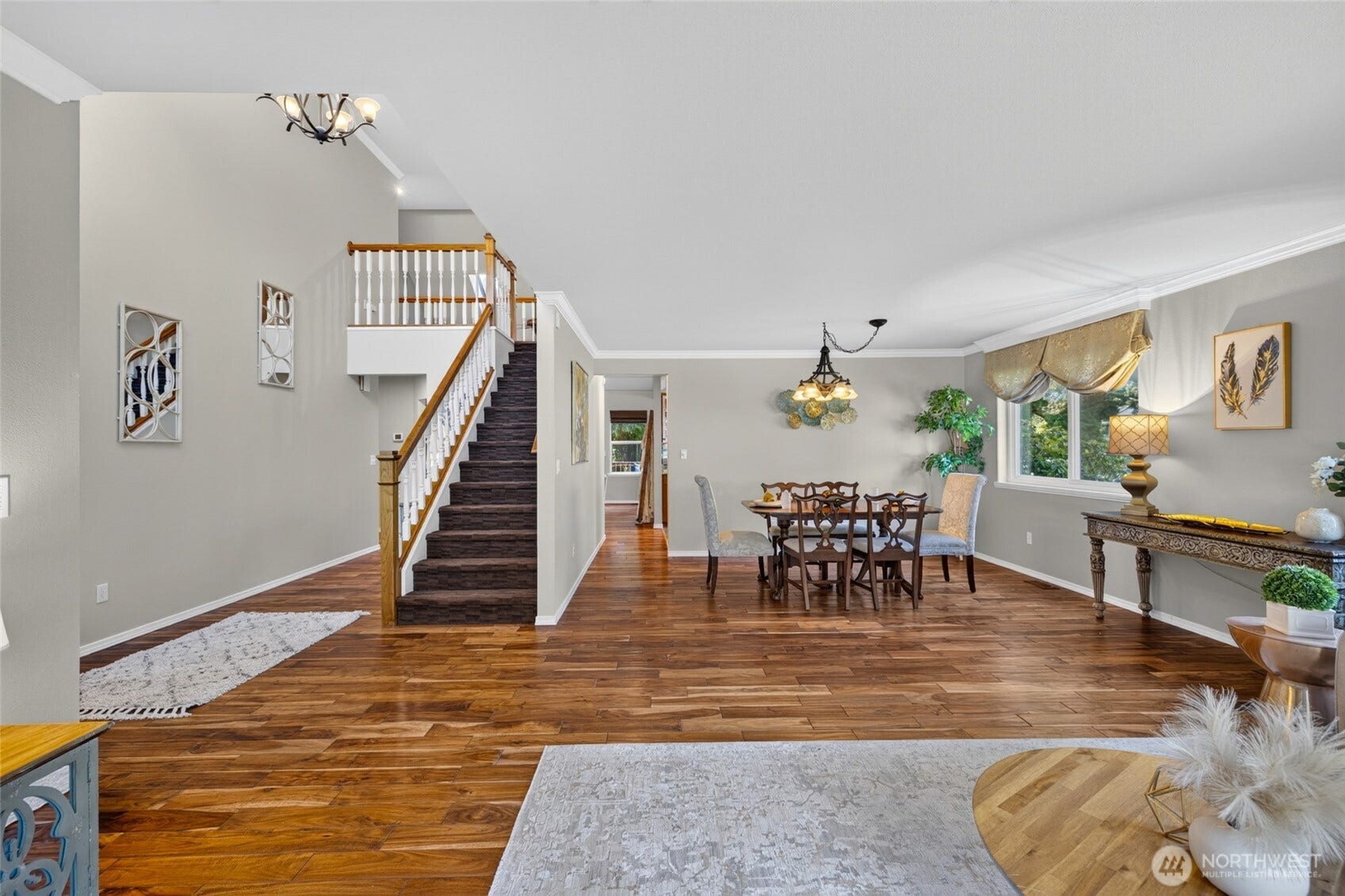 From living room looking back toward the dining room, entry on the left and stairway.