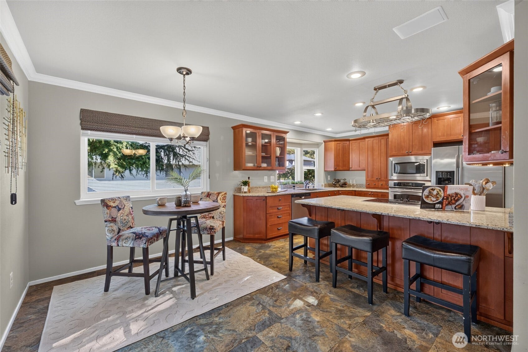 Enjoy less formal dining at the kitchen bar and breakfast nook.