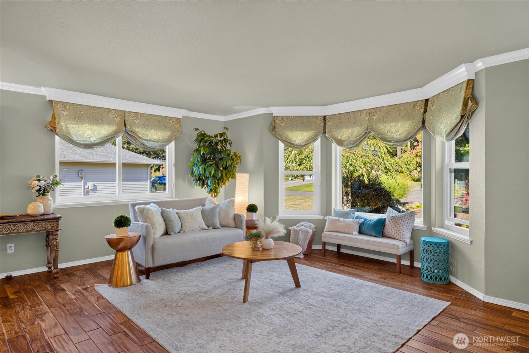 Plenty of sunlight and engineered hardwood floors.