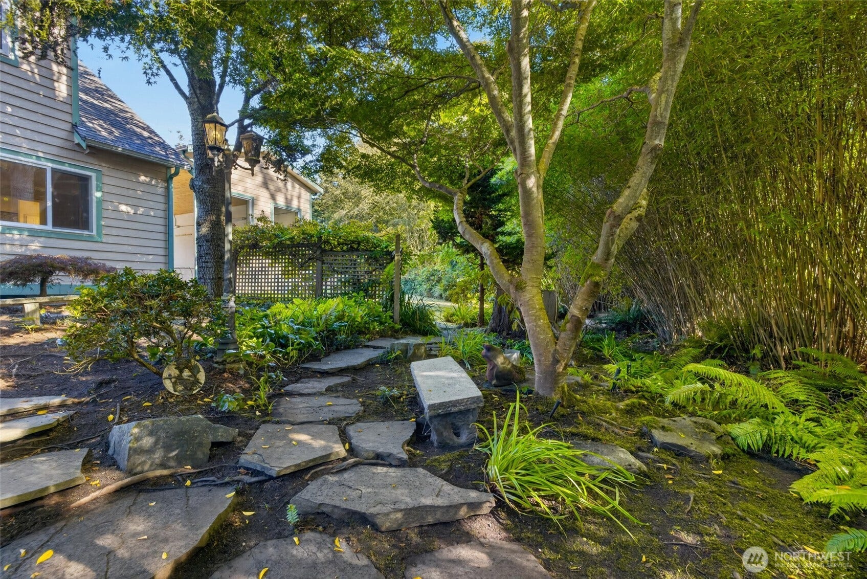 A wall of bamboo on the right provides privacy from neighboring homes along the back.