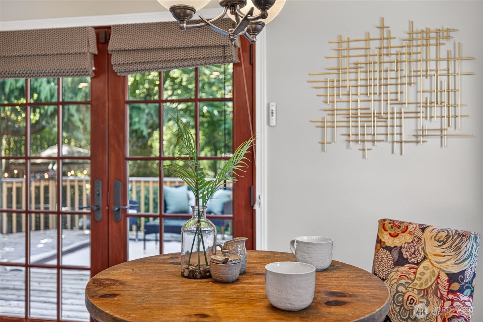 Breakfast nook provides view through french doors to the backyard oasis.