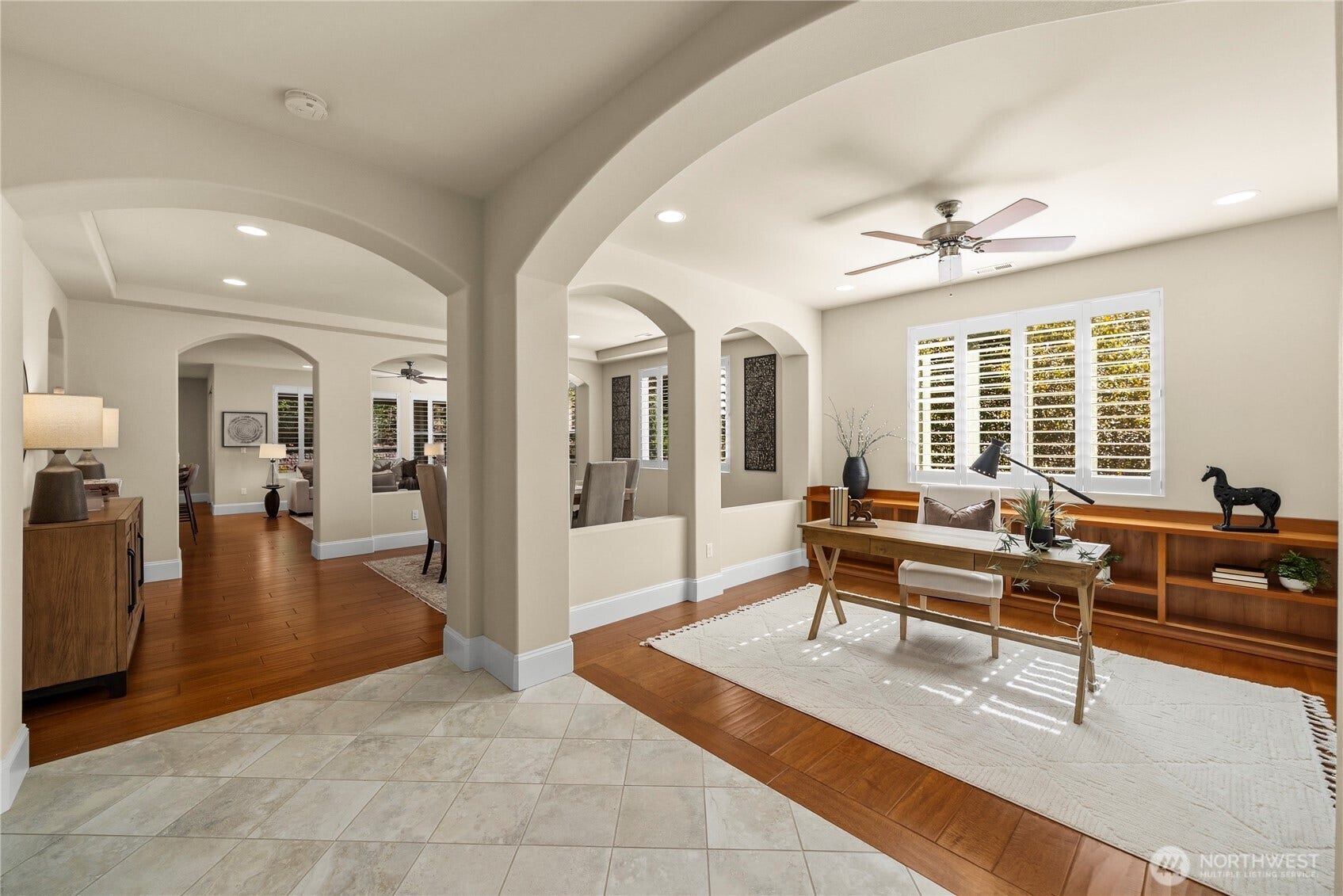 14721 Knoll Park Court E, Bonney Lake, WA 98391 Enter this stunning home and you will notice that all you see are trees from nearly every window! The elegant arches, Tiled entryway, Engineered hardwoods and Plantation shutters are just some of the amazing features of this home.