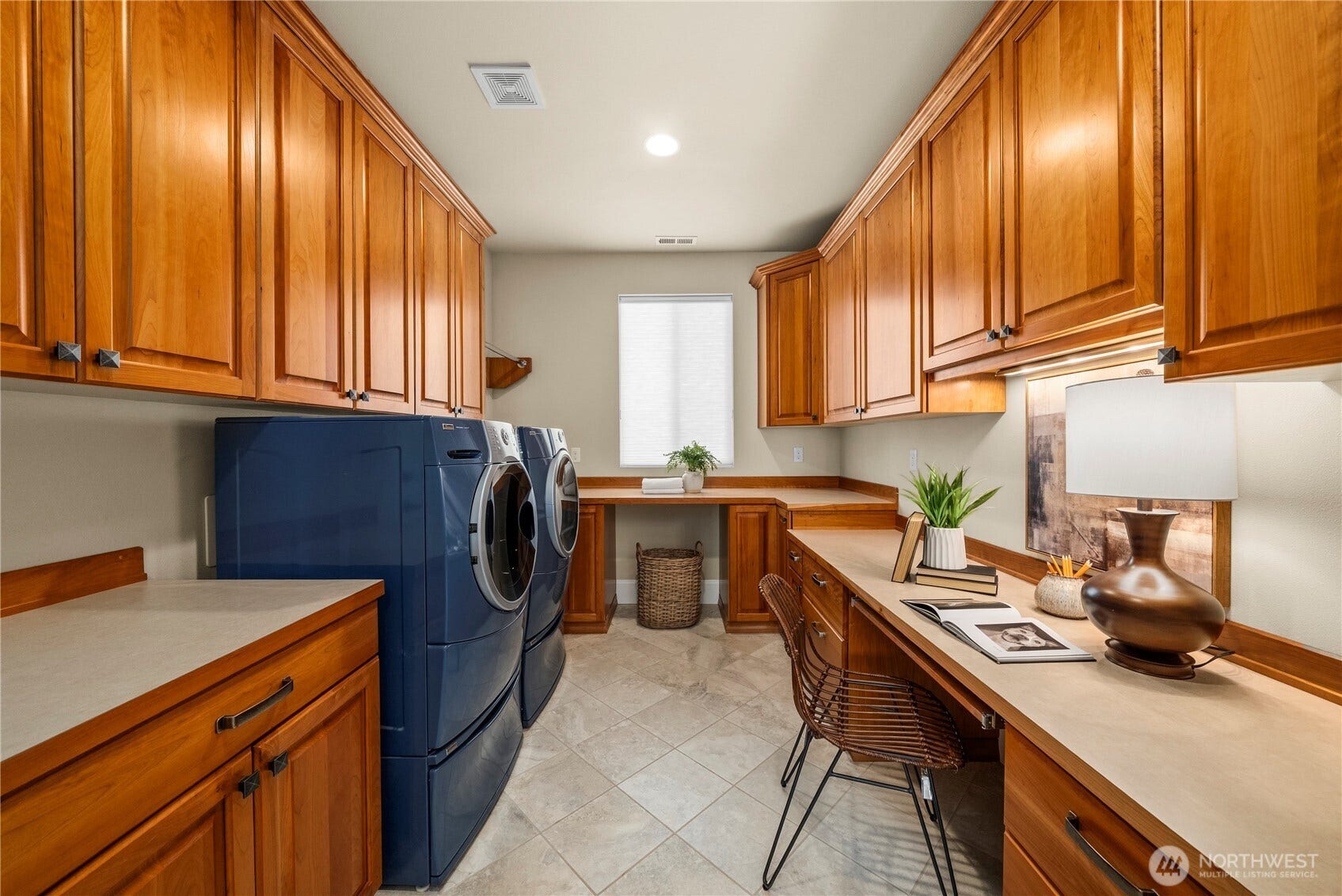 14721 Knoll Park Court E, Bonney Lake, WA 98391 The laundry room offers tile flooring, a convenient work/craft space and tons of storage.