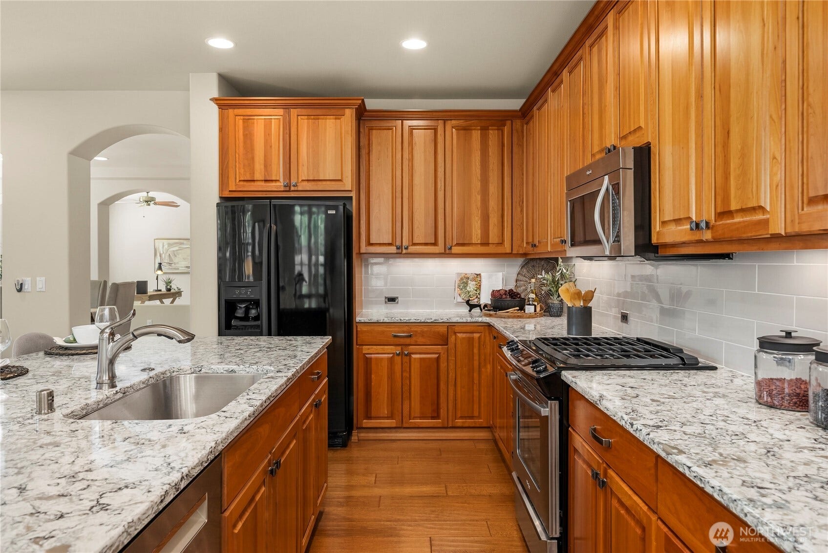 14721 Knoll Park Court E, Bonney Lake, WA 98391 Gorgeous cherry 42" cabinets with crown, Quartz counters, full height backsplash.